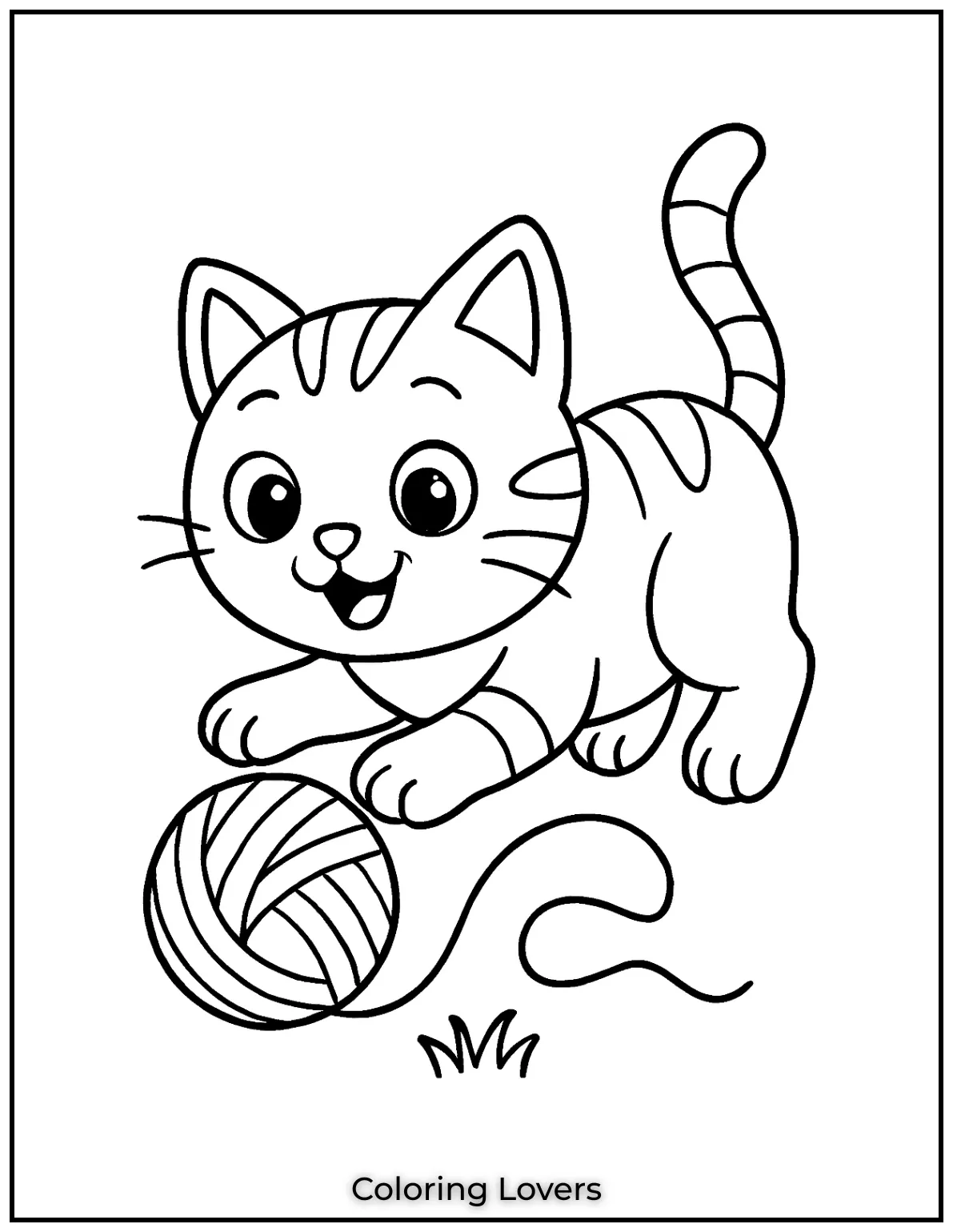 Happy kitten playing with a ball of yarn